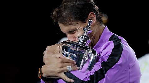 In this Sept. 8, 2019, file photo, Rafael Nadal, of Spain, hugs the trophy after defeating Daniil Medvedev, of Russia, to win the men's singles final of the U.S. Open tennis championships in New York. The U.S. Tennis Association intends to hold the U.S. Open Grand Slam tournament in New York starting in August without spectators, if it gets governmental support -- and a formal announcement could come this week.