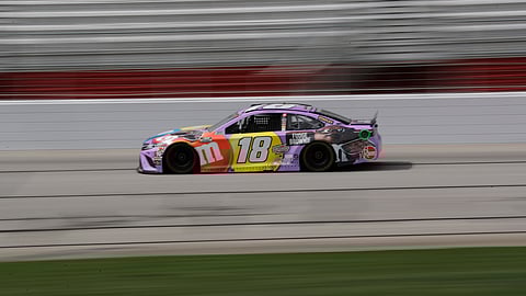 Kyle Busch (18) drives during a NASCAR Cup Series auto race at Atlanta Motor Speedway, Sunday, June 7, 2020, in Hampton, Ga.