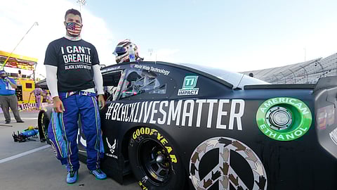 Driver Bubba Wallace waits for the start of a NASCAR Cup Series auto race Wednesday, June 10, 2020, in Martinsville, Va.