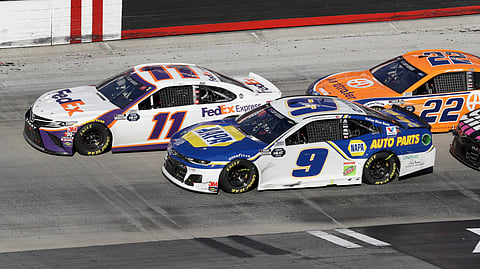 Denny Hamlin (11) drives followed by Chase Elliott (9) and Joey Logano (22) during a NASCAR Cup Series auto race at Bristol Motor Speedway Sunday, May 31, 2020, in Bristol, Tenn.