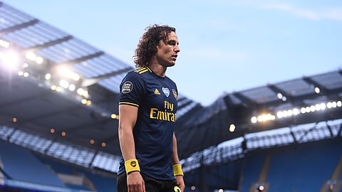 Arsenal's David Luiz leaves the field after getting a red card during the English Premier League soccer match between Manchester City and Arsenal at the Etihad Stadium in Manchester, England, Wednesday, June 17, 2020.
