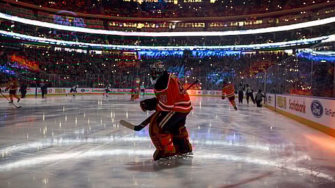 In this Feb. 20, 2020, file photo, Edmonton Oilers goalie Mike Smith warms up for the team's NHL hockey game against the Winnipeg Jets in Edmonton, Alberta. Deputy Commissioner Bill Daly told The Associated Press on Sunday, July 5, that the NHL and NHL Players’ Association have agreed on protocols to resume the season.