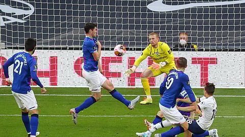 Tottenham's Giovani Lo Celso, right, scores the opening goal during the English Premier League soccer match between Tottenham Hotspur and Everton FC at the Tottenham Hotspur Stadium in London, England, Monday, July 6, 2020.