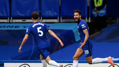 Chelsea's Olivier Giroud, right, celebrates with teammate Jorginho after scoring his sides second goal during the English Premier League soccer match between Chelsea and Wolverhampton Wanderers at Stamford Bridge, in London, Sunday July 26, 2020.