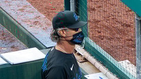 Miami Marlins' manager Don Mattingly looks out from the dugout during the eighth inning of a baseball game against the Philadelphia Phillies, Saturday, July 25, 2020, in Philadelphia.