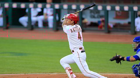 Cincinnati Reds' Shogo Akiyama hits a fly ball for an out during the third inning of a baseball game against the Chicago Cubs in Cincinnati, Tuesday, July 28, 2020.