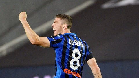 Atalanta's Robin Gosens celebrates after scoring a goal during a Serie A soccer match between Atalanta and Lazio, at the Gewiss Stadium in Bergamo, Italy, Wednesday, June 24, 2020.