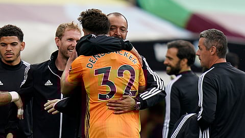 Wolverhampton Wanderers' head coach Nuno Espirito Santo hugs goalscorer Leander Dendoncker at the end of the English Premier League soccer match between Aston Villa and Wolverhampton Wanderers at Villa Park in Birmingham, England, Saturday, June 27, 2020. Wolverhampton won 1-0.