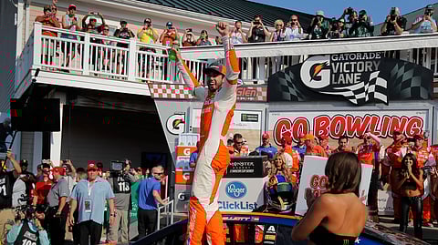 In this Aug. 5, 2018, file photo, Chase Elliott, center, celebrates after winning a NASCAR Cup Series auto race in Watkins Glen, N.Y. Three months after its opening day was canceled by the coronavirus pandemic, Watkins Glen International is hosting car clubs again as NASCAR weekend looms in mid-August. “Everybody is excited about getting back in the saddle. I know we are," track president Michael Printup said.