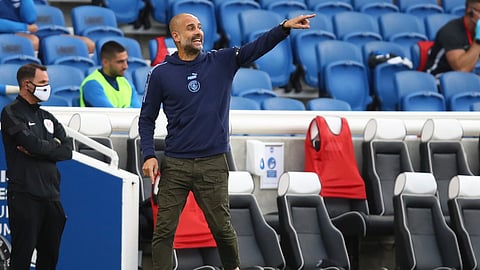 Manchester City's head coach Pep Guardiola gestures during the English Premier League soccer match between Brighton and Manchester City at the Falmer stadium in Brighton, England, Saturday, July 11, 2020.