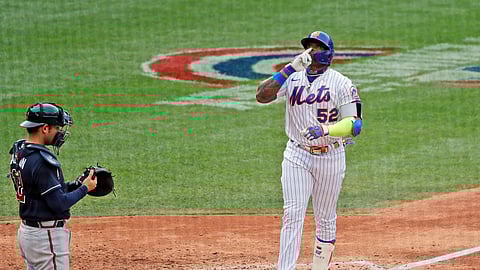 New York Mets' Yoenis Cespedes, right, celebrates his solo home run during the seventh inning of a baseball game against the Atlanta Braves at Citi Field, Friday, July 24, 2020, in New York. (AP Photo/Seth Wenig)