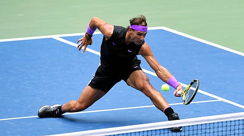 In this Sept. 8, 2019, file photo, Rafael Nadal, of Spain, returns a shot to Daniil Medvedev, of Russia, during the men's singles final of the U.S. Open tennis championships in New York. Defending champion Rafael Nadal will skip the U.S. Open because of the coronavirus pandemic.