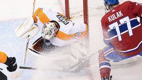 Philadelphia Flyers goaltender Carter Hart (79) makes a save on Montreal Canadiens defenceman Brett Kulak (77) during the second period of an NHL Eastern Conference Stanley Cup first-round playoff game in Toronto, Ontario, Tuesday, Aug. 18, 2020.