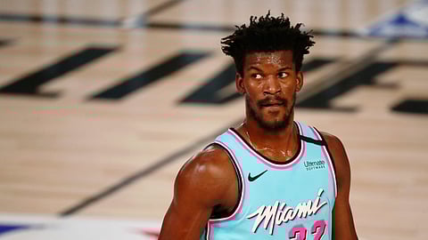 Miami Heat forward Jimmy Butler waits between plays during the first half of the team's NBA basketball game against the Indiana Pacers on Monday, Aug. 10, 2020, in Lake Buena Vista, Fla.