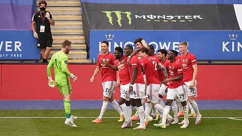 Manchester United's Jesse Lindgard celebrates with teammates after scoring his side's second goal during the English Premier League soccer match between Leicester City and Manchester United at the King Power Stadium, in Leicester, England, Sunday, July 26, 2020.