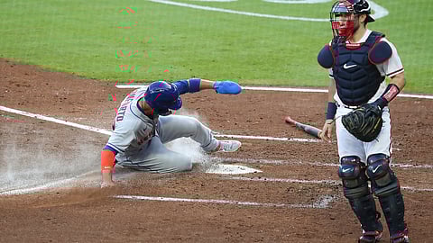New York Mets' Michael Conforto scores past Atlanta Braves catcher Travis D'Arnaud on a single by Robinson Cano during the third inning of a baseball game Monday, Aug. 3, 2020,, in Atlanta.