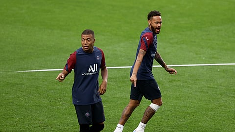 PSG's Kylian Mbappe and Neymar, right, gesture during a training session at the Luz stadium in Lisbon, Tuesday Aug. 11, 2020. PSG will play Atalanta in a Champions League quarterfinals soccer match on Wednesday.