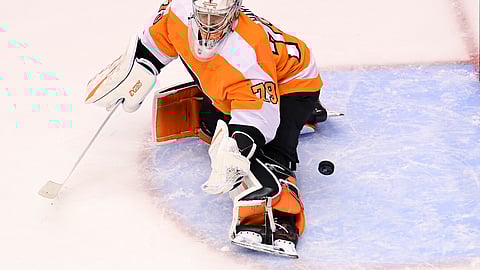 Philadelphia Flyers goaltender Carter Hart (79) fails to stop the puck on a shot from New York Islanders defenseman Andy Greene during first-period NHL Stanley Cup Eastern Conference playoff hockey game action in Toronto, Monday, Aug. 24, 2020.