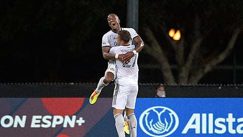 Philadelphia Union forward Sergio Santos (17) is congratulated by defender Kai Wagner (27) after Santos scored a goal during the first half of an MLS soccer match against Sporting Kansas City, Thursday, July 30, 2020, in Kissimmee, Fla.