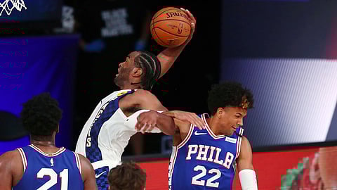 T.J. Warren (white jersey) and Joel Embiid (21) helped us capture every one of our Sixers-Pacers Totals Props on Saturday