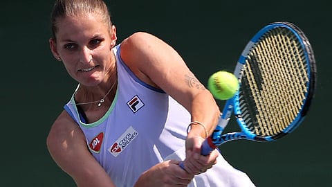 FILE - In this Thursday, Feb. 20, 2020, file photo, Karolina Pliskova of Czech Republic returns the ball to Kazakhstan's Elena Rybakina during a match of the Dubai Duty Free Tennis Championship in Dubai, United Arab Emirates. Pliskova is scheduled to play in the U.S. Open, scheduled for Aug. 31-Sept. 13, 2020.
