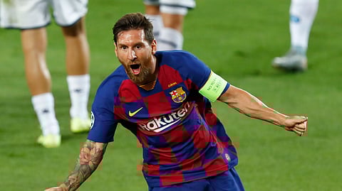 Barcelona's Lionel Messi celebrates after scoring his side's second goal during the Champions League round of 16, second leg soccer match between Barcelona and Napoli at the Camp Nou Stadium in Barcelona, Spain, Saturday, Aug. 8, 2020.