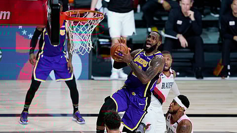 Los Angeles Lakers forward LeBron James (23) drives to the basket against the Portland Trail Blazers during the second half of an NBA basketball first round playoff game, Saturday, Aug. 22, 2020, in Lake Buena Vista, Fla.