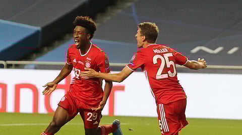 Bayern's Kingsley Coman, left, celebrates with teammate Thomas Mueller after scoring his sides first goal during the Champions League final soccer match between Paris Saint-Germain and Bayern Munich at the Luz stadium in Lisbon, Portugal, Sunday, Aug. 23, 2020.