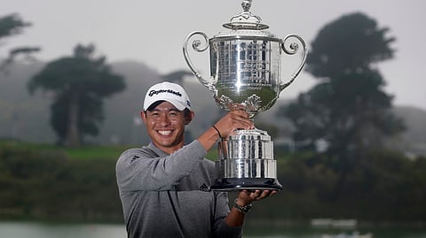 Collin Morikawa holds the Wanamaker Trophy after winning the PGA Championship golf tournament at TPC Harding Park Sunday, Aug. 9, 2020, in San Francisco.