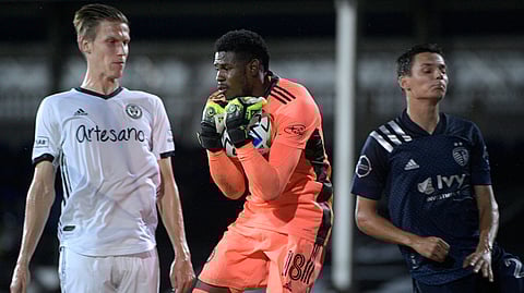 Philadelphia goalkeeper Andre Blake (18) makes a save in a quarterfinal match on July 30
