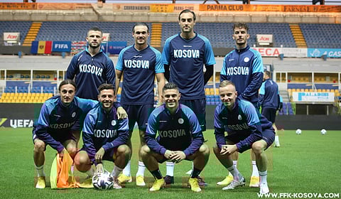 Kosovo takes a moment away from practice before their game against Moldova.