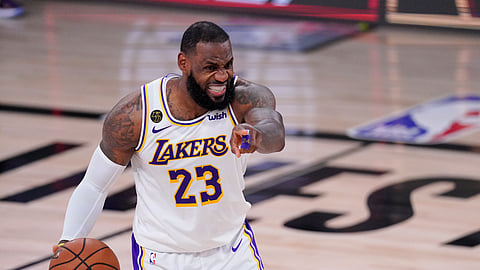 Los Angeles Lakers' LeBron James (23) directs the offense during the second half of an NBA conference semifinal playoff basketball game against the Houston Rockets Saturday, Sept. 12, 2020, in Lake Buena Vista, Florida.