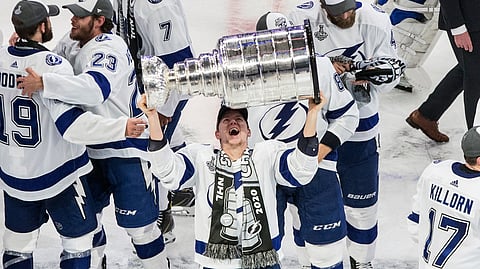 Tampa Bay Lightning's Ondrej Palat (18) hoists the Stanley Cup after defeating the Dallas Stars in the NHL Stanley Cup hockey finals, in Edmonton, Alberta, on Monday, Sept. 28, 2020.