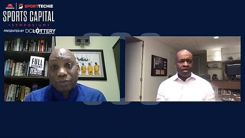 Howard Bryant and DeMaurice Smith speaking at the 2020 Sports Capital Symposium