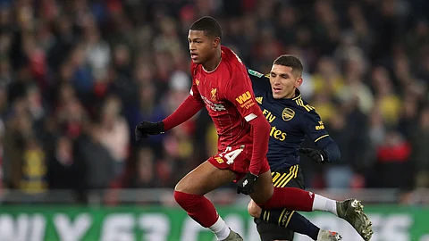 In this Wednesday, Oct. 30, 2019 file photo, Liverpool's Rhian Brewster, left, duels for the ball with Arsenal's Lucas Torreira during their English League Cup soccer match at Anfield stadium in Liverpool, England.