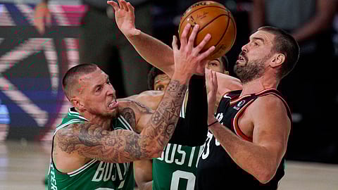 Boston Celtics center Daniel Theis (27) shoots over Toronto Raptors center Marc Gasol (33) during the second half of an NBA conference semifinal playoff basketball game Wednesday, Sept. 9, 2020, in Lake Buena Vista, Fla.