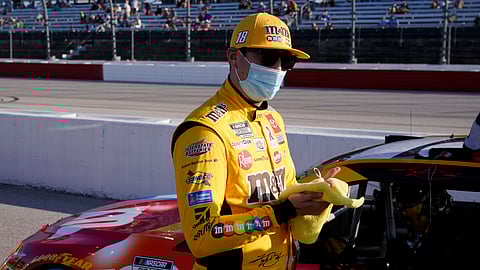 Kyle Busch (18) speaks with his crew before a NASCAR Cup Series auto race Sunday, Sept. 6, 2020, in Darlington, S.C.