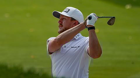 Mackenzie Hughes, of Canada, hits out of a bunker during a practice round for the US Open Golf Championship, Wednesday, Sept. 16, 2020, in New York. Hughes is at 14-1 to win the Corales Puntacana Resort & Club Championship. Hughes was second last year and had played well in the FedExCup playoffs before missing the cut at the Open.
