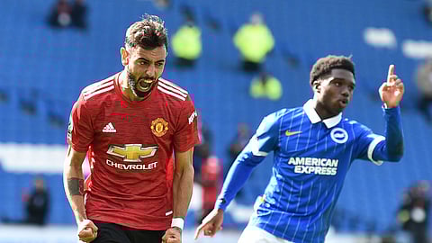 Manchester United's Bruno Fernandes celebrates after he scores his sides third goal from the penalty spot during the English Premier League soccer match between Brighton Hove Albion and Manchester United in Brighton, England, Saturday, Sept. 26, 2020.