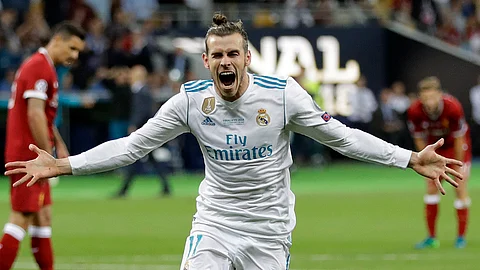 In this Saturday, May 26, 2018 file photo Real Madrid's Gareth Bale celebrates after scoring his side's second goal during the Champions League Final soccer match between Real Madrid and Liverpool at the Olimpiyskiy Stadium in Kiev, Ukraine.