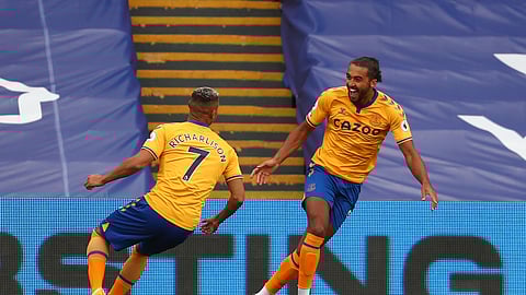 Everton's Dominic Calvert-Lewin, right, celebrates his goal against Crystal Palace during the English Premier League soccer match between Crystal Palace and Everton, at Selhurst Park, London, Saturday, Sept. 26, 2020.