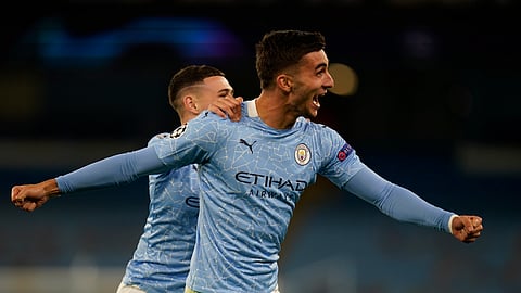 Manchester City's Ferran Torres celebrates after scoring his side's third goal during the Champions League group C soccer match between Manchester City and FC Porto at the Etihad stadium in Manchester, England, Wednesday, Oct. 21, 2020.