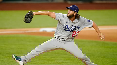 Los Angeles Dodgers starting pitcher Clayton Kershaw throws against the Atlanta Braves during the first inning in Game 4 of a baseball National League Championship Series Thursday, Oct. 15, 2020, in Arlington, Texas.