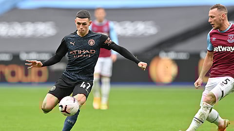 Manchester City's Phil Foden scores his side's opening goal during the English Premier League soccer match between West Ham and Manchester City, at the London Olympic Stadium Saturday, Oct. 24, 2020.