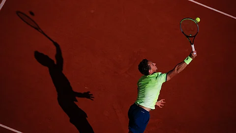 Spain's Roberto Carballes Baena serves against Canada's Denis Shapovalov in the second round match of the French Open tennis tournament at the Roland Garros stadium in Paris, France, Thursday, Oct. 1, 2020.