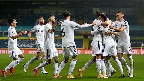 Leeds United's Rodrigo, 2nd right, celebrates after scoring his side's first goal during the English Premier League soccer match between Leeds United and Manchester City at Elland Road in Leeds, England, Saturday, Oct. 3, 2020.