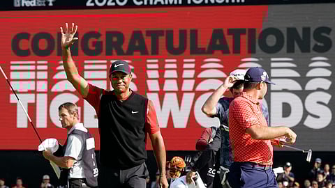In this Oct. 28, 2019 photo, Tiger Woods celebrates after winning the Zozo Championship golf tournament at the Accordia Golf Narashino country club in Inzai, east of Tokyo, Japan. Woods is the defending champion at a course where he has won five times. The Zozo Championship is the second Asia-based event to move to the United States this year because of the COVID-19 pandemic.