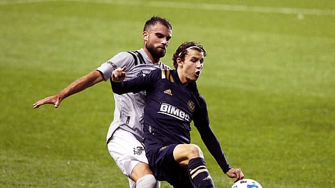 Brenden Aaronson, right, of the Philadelphia Union and Rudy Camacho of the Montreal Impact battle for the ball in the first half on Sunday, Oct. 11, 2020, in Chester, Pa.