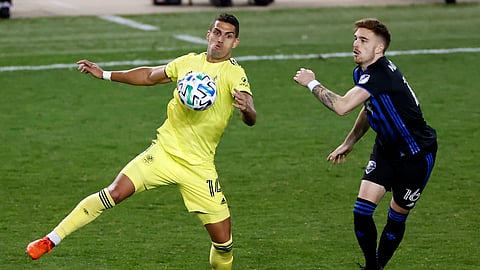 Nashville SC forward Daniel Rios (14) controls the ball in front of Montreal Impact defender Joel Waterman (16) during the second half of an MLS soccer match, Tuesday, Oct. 27, 2020, in Harrison, N.J. Nashville won 1-0.