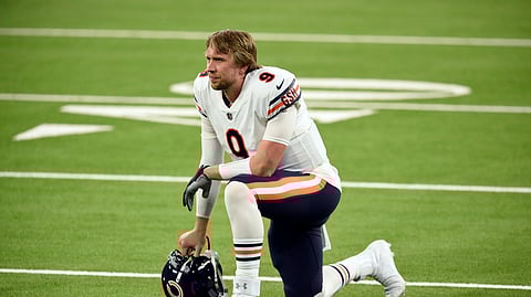 Chicago Bears quarterback Nick Foles (9) kneels on the field in the closing minutes of a loss to the Los Angeles Rams in an NFL football game Monday, Oct. 26, 2020, in Inglewood, Calif.